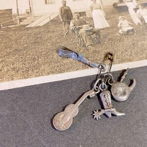 4 Vintage Southwest theme Pendant Charms including Guitar, Cowboy Boot, & Pipe